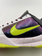Close-up of the iridescent purple side panel and bright green Swoosh.