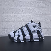 Three-quarter view of the sneaker highlighting its panda graphics and sculpted sole.