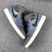 Top-down view of the pair highlighting the gray, purple, black, and white color blocking.