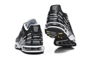 Rear and outsole views of black and white Nike Air Max Plus III sneakers