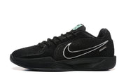 Side profile of a black sneaker with a white Swoosh-style logo, black midsole, and small metallic side detail.