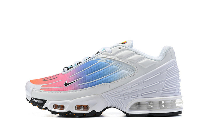 White Nike Air Max Tn-style sneaker with pink and blue gradient accents and a transparent heel cushioning unit