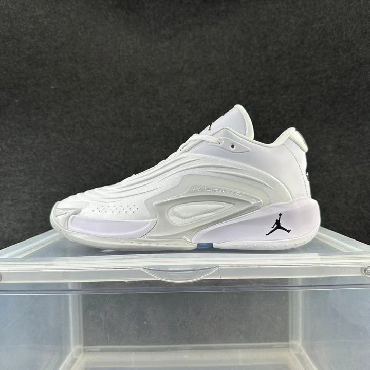 Side view of a white and gray Jordan basketball sneaker with a sculpted side panel and black Jumpman logo.