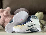 Pair of Nike basketball shoes with the patterned outsole visible.
