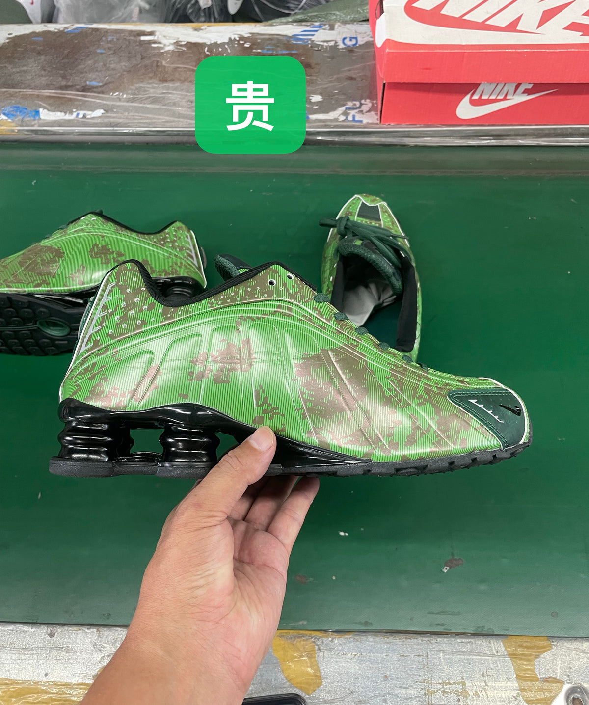 Green graphic-patterned low-top sneaker with dark laces and column-style heel detail