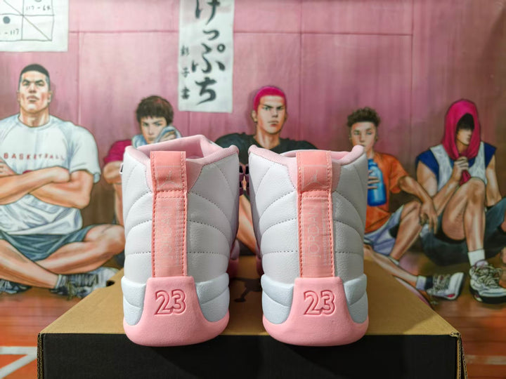 Rear view of white and pink high-top sneakers showing the pink heel panels, raised 23 details, and Jumpman branding.