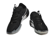 Front and angled views of black Nike G.T. Cut 3 shoes with white Swoosh logos and translucent outsoles.