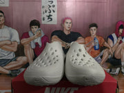 Front view of white perforated slip-on clogs
