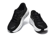 Pair of black Nike Comfort Ride EasyOn sneakers shown from above, highlighting the laces and padded collars.