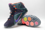 High-top sneaker pair showing the side profile and translucent outsole with multicolor hexagonal sections.
