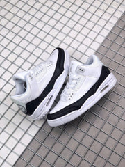 Pair of white and black sneakers displayed together from an angled side view.