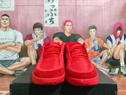 Front view showing the red laces, textured toe panels, and rubber outsoles.