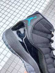 Side close-up showing the black glossy panel, textured upper, blue tongue branding and dark outsole.
