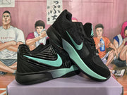 Angled display of the black and mint-green basketball sneakers, showing the side branding, mesh upper, and layered midsole.