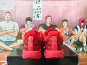 Rear view showing the padded collars, heel panels, and red outsole construction.