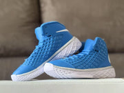 Two blue high-top sneakers posed together with white side branding and outsoles.