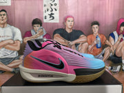 Side view of pink and blue Nike basketball sneakers with black laces, a black-and-blue Swoosh, purple heel detailing, and a gum-colored outsole.