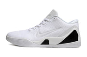 Side view of an all-white low-top basketball shoe.