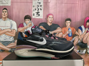 Pair of black and white Nike basketball sneakers shown from the side on a shoebox.