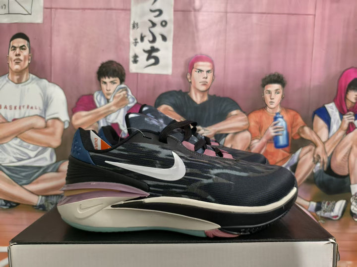 Pair of black and white Nike basketball sneakers shown from the side on a shoebox.
