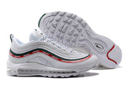 Nike Air Max 97 side view with the outsole visible, showing the red and green side bands and tread pattern.