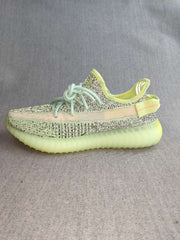 Profile view highlighting the side stripe, patterned upper, and ridged sole.