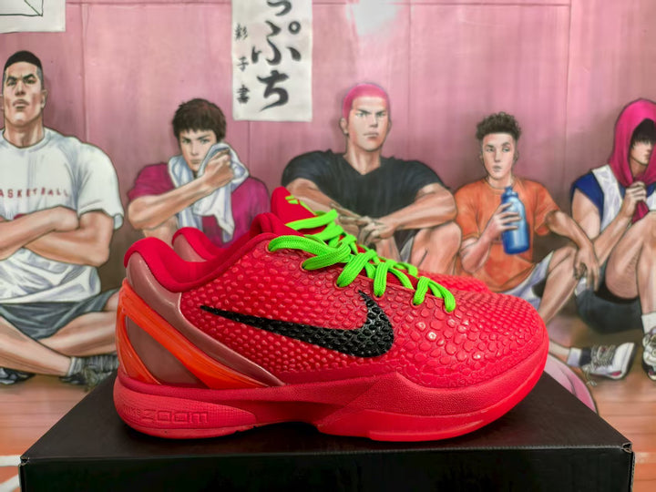 Side view of red Nike basketball sneakers with a textured upper, black swoosh, and neon green laces.