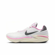 White Nike GT Cut 2 sneaker with a black Swoosh, pink collar, pink forefoot accent, and cream-colored sole.