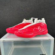 Three-quarter view of the red and white sneaker pair with sculpted layered side panels.