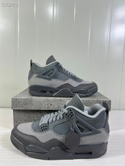 Two grey Air Jordan 4 Retro SE sneakers shown from angled side views on a textured display box.