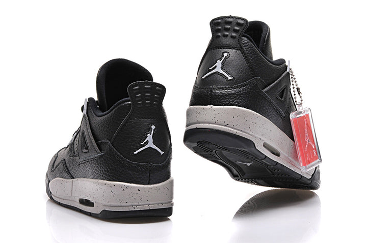 Pair of black and grey Air Jordan 4-style sneakers shown from the rear and side.
