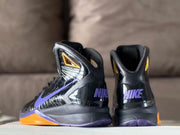 Rear view showing purple Nike branding on the heels