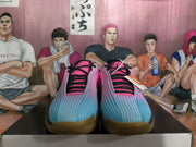 Top-front view showing the blue-to-pink gradient upper, black laces, textured panels, and gum-colored toe outsole.