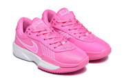 Pair of pink Nike sneakers shown at an angled front view with lace-up closures and white accents.