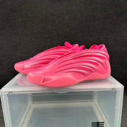 Pair of vivid pink basketball-style sneakers shown at a three-quarter angle.