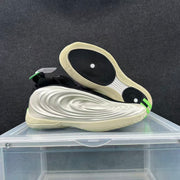 Angled view of the sneaker pair showing the sculpted sidewalls and black outsole traction areas.