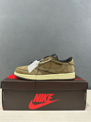 Side view of the olive green low-top sneaker with cream midsole and black outsole.