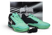 Black and green Nike Sabrina 4 shoes displayed with a shoe box