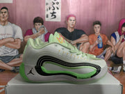 Side view showing layered black detailing, green accents, Jordan branding, and a visible CUSHION marking.