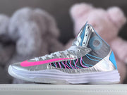 Side view of a silver high-top sneaker with pink, blue, and dark gray accents