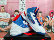Angled view of the pair highlighting the side panels, blue and red color blocking, laces, and white midsole.