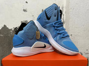 Pair of blue high-top basketball shoes shown from the side and at an angle.