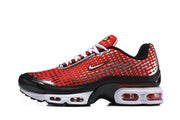 Side view of red patterned Nike Air Max Plus sneakers with white laces and visible cushioning windows