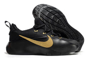 Black and gold sneaker showing the textured side panel and patterned outsole.