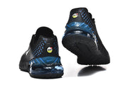 Rear and outsole views of black Nike sneakers with blue heel accents.