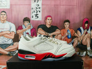 Side view of a white low-top sneaker with red and black accents.
