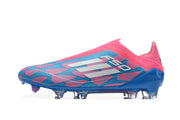 Side view of a pink and blue laceless adidas F50 soccer cleat with a studded outsole.