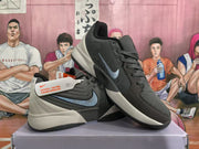 Angled view of two gray Nike sneakers showing the blue Swoosh, textured uppers, padded collars, and contrasting soles.