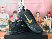 Angled view showing the textured black upper and gold Swoosh