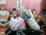 Pair of gray and white Nike sneakers shown from an angled side view, highlighting the textured upper and contrasting swoosh details.